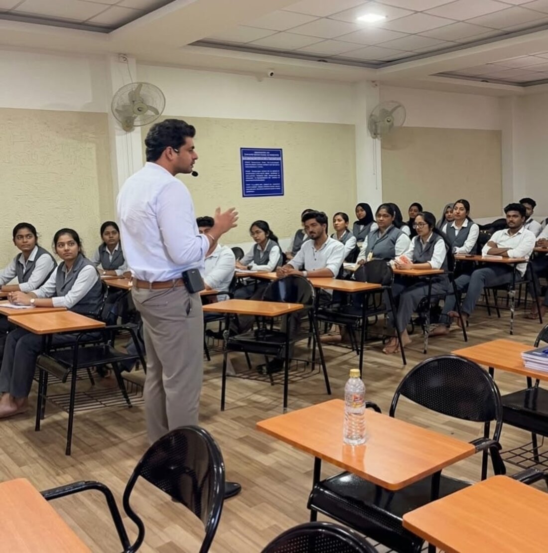 An iSkew trainer leading a placement-readiness session with a full class on campus